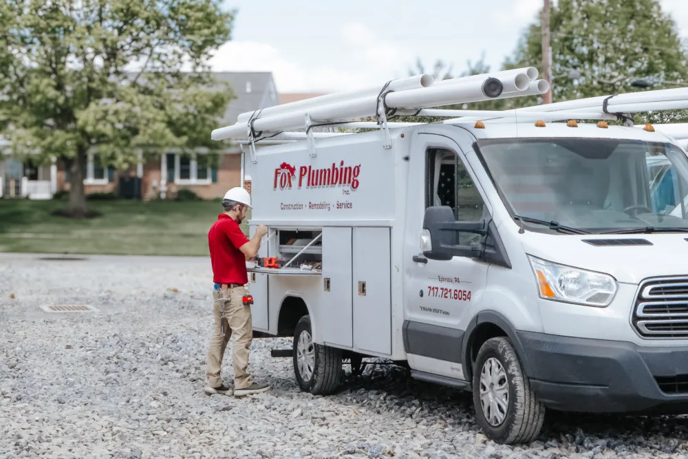 Fox plumbing company service van parked on-site in Lancaster, PA